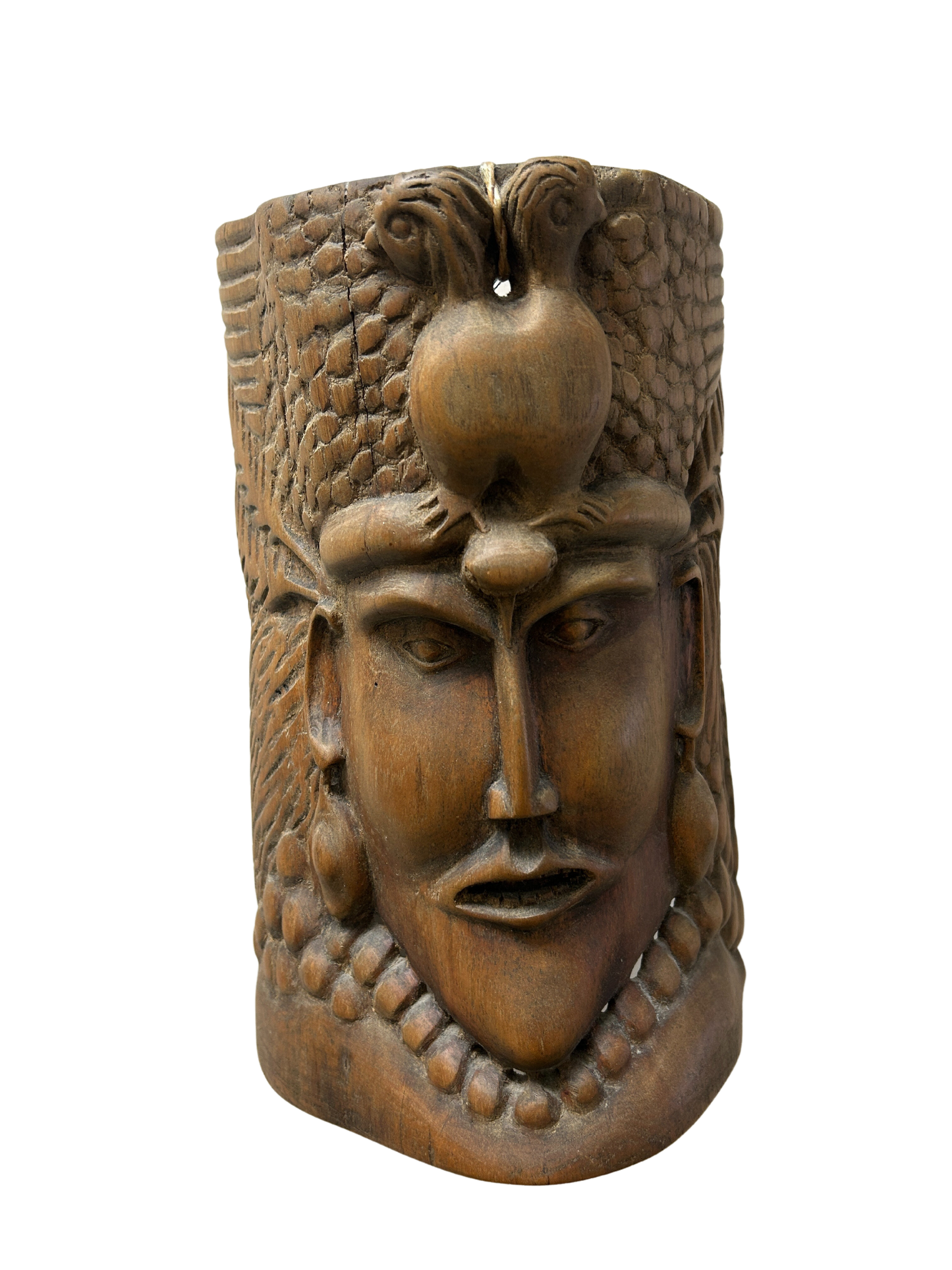 Wood mask with intricately carved jaw and relief details, blending ancient traditions with modern artistry as a culturally rich fashion accessory, available to benefit Allard Audiology.