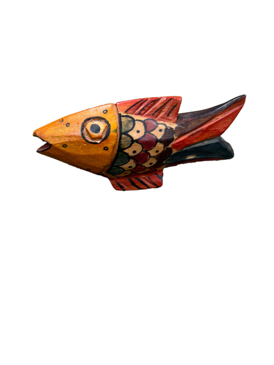 This wooden artifact, shaped like a fish and adorned with triangular motifs in shades of carmine and electric blue, stands as a testament to innovative craftsmanship, a distinctive addition available at the hearing clinic at Allard Audiology.
