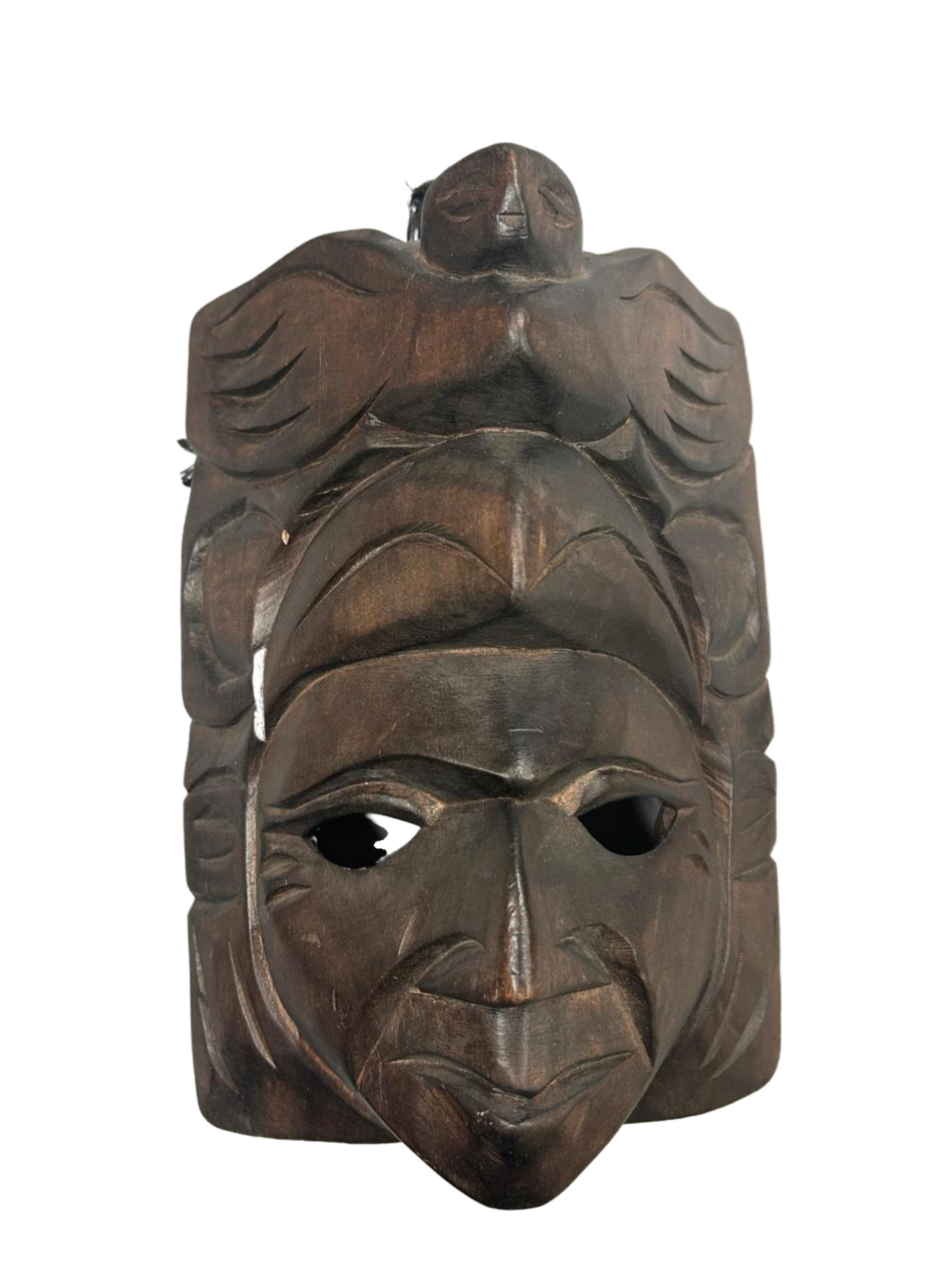 This masterful wooden mask, echoes historical aesthetics, with accents amplifying its rich heritage and artistic value, available as shown at the hearing clinic at Allard Audiology.